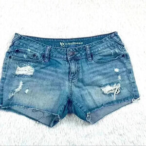 B By Bullhead Med Wash Lowrise Distress Faded Cheeky Raw Hem Jean Shorts Size 9
